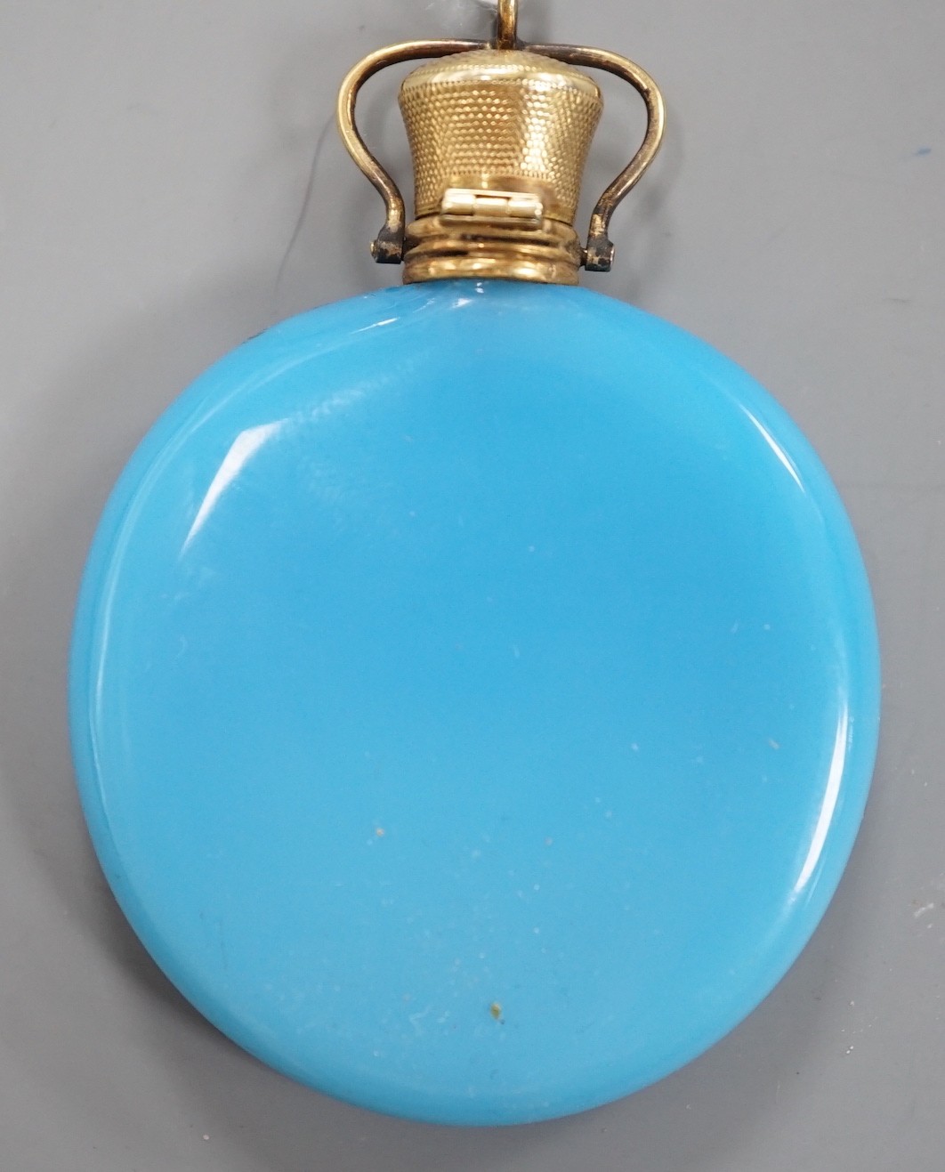 A French? yellow metal mounted blue glass moon shaped scent flask, 56mm.